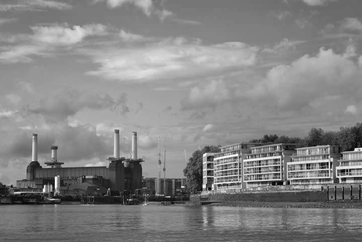 Battersea Power Station  under a cloudy sky in black and white