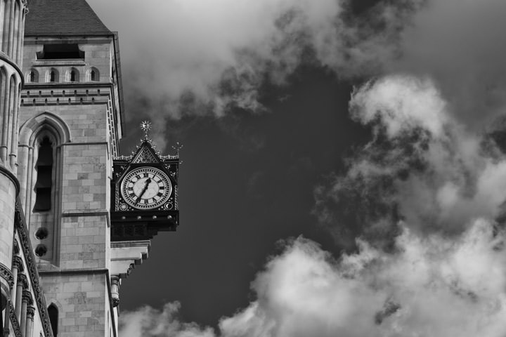 Black and white photo of the clock at the Royal Courts of Justice Fleet Street 