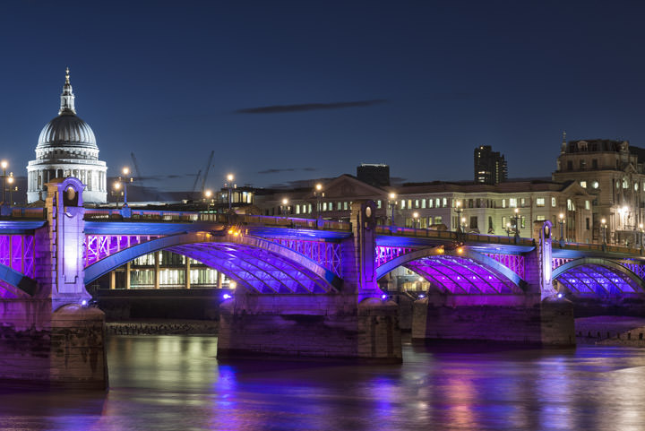 Night image St Pauls in white - Southwark Bridge in purple